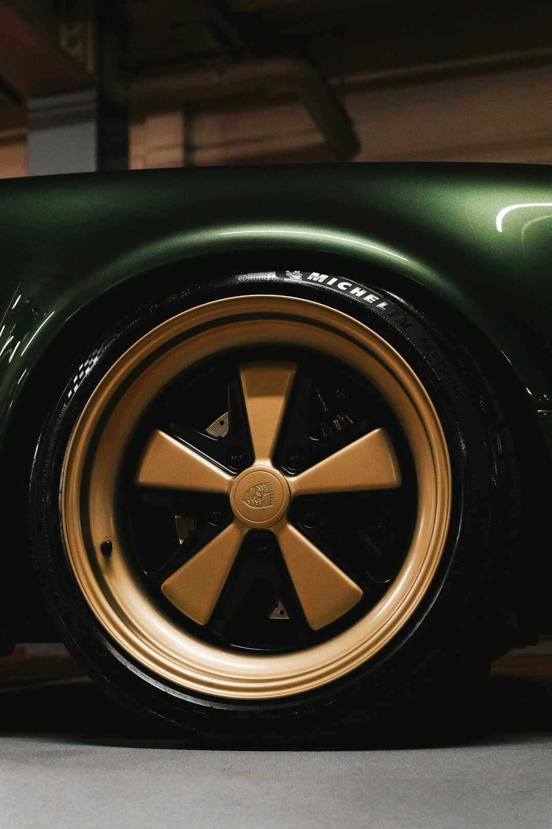 Car wheel arch with protective coating