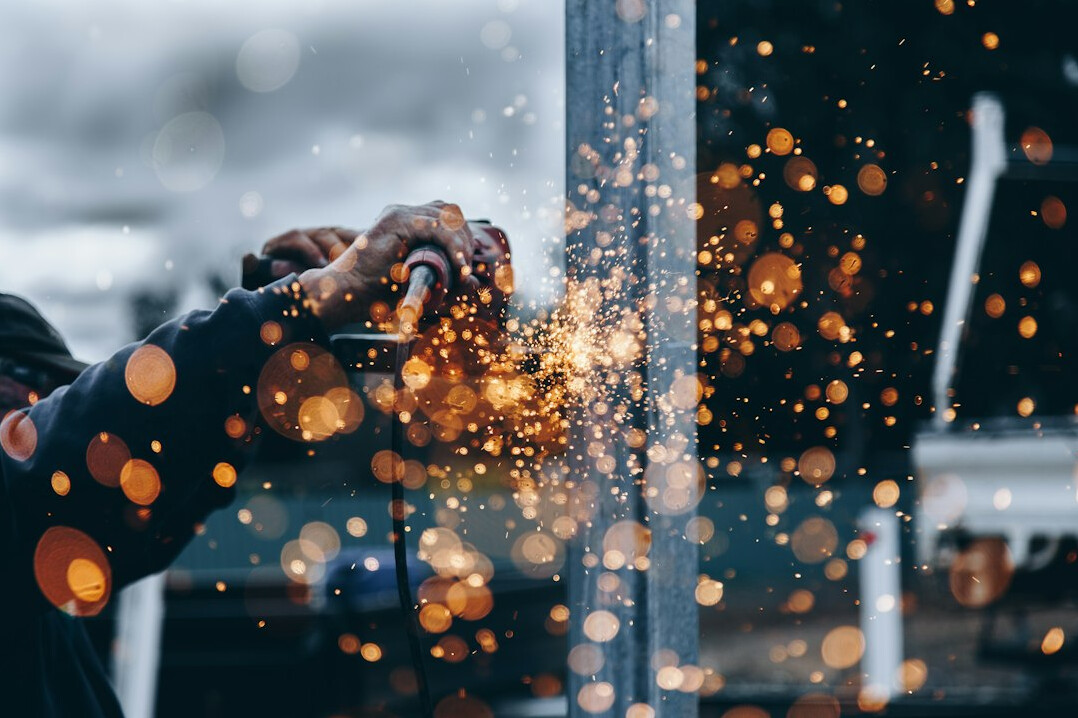 Power tool removing rust from metal
