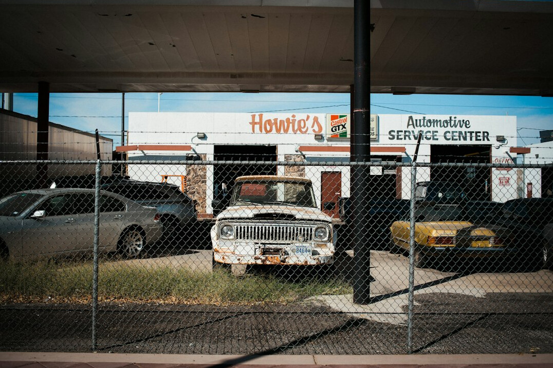 Car parked outside an auto workshop